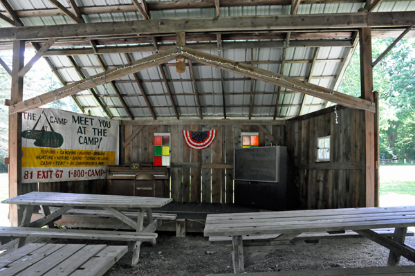 a shelter of tables, TV and more